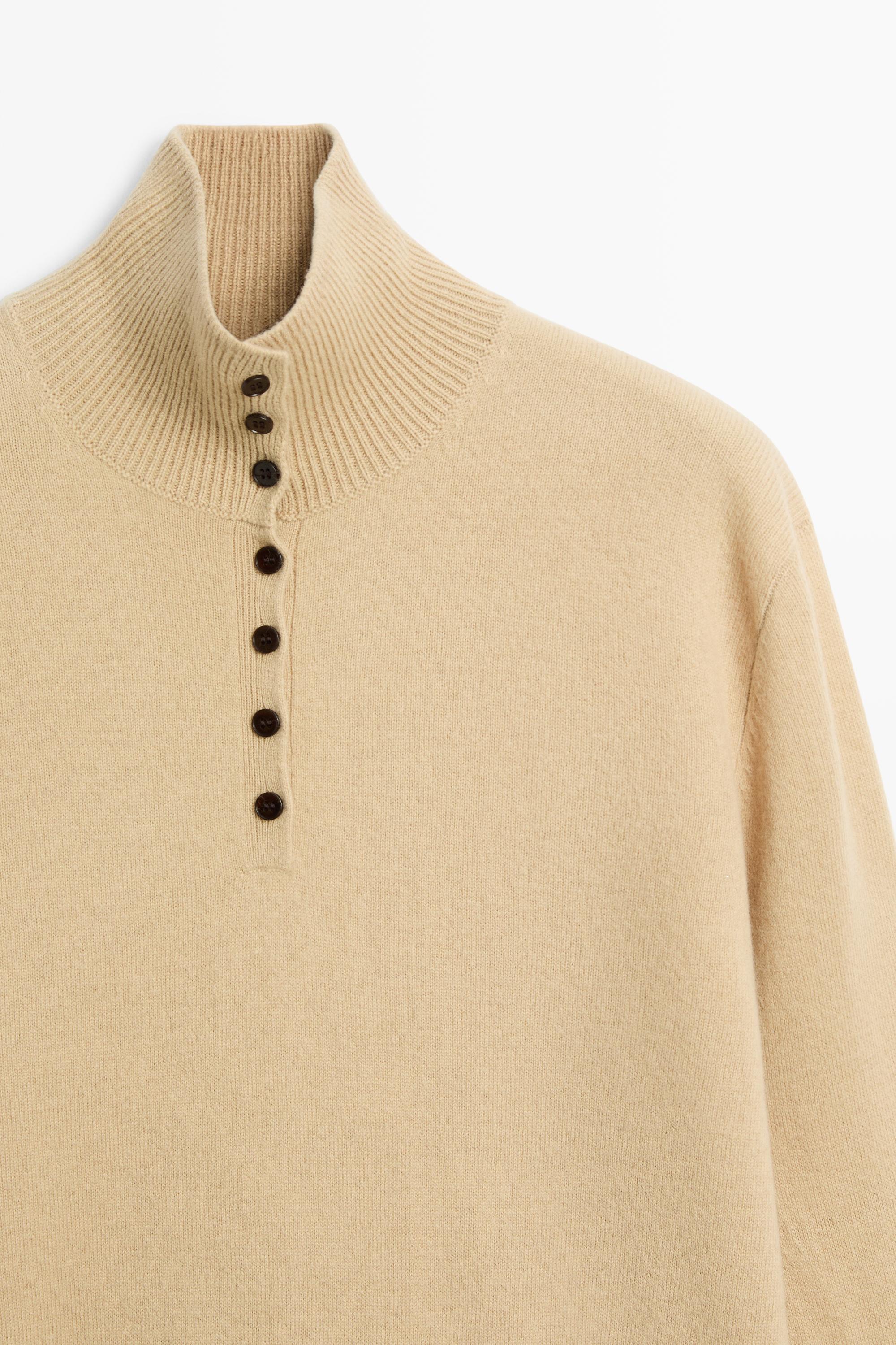 High neck knit sweater with button detail